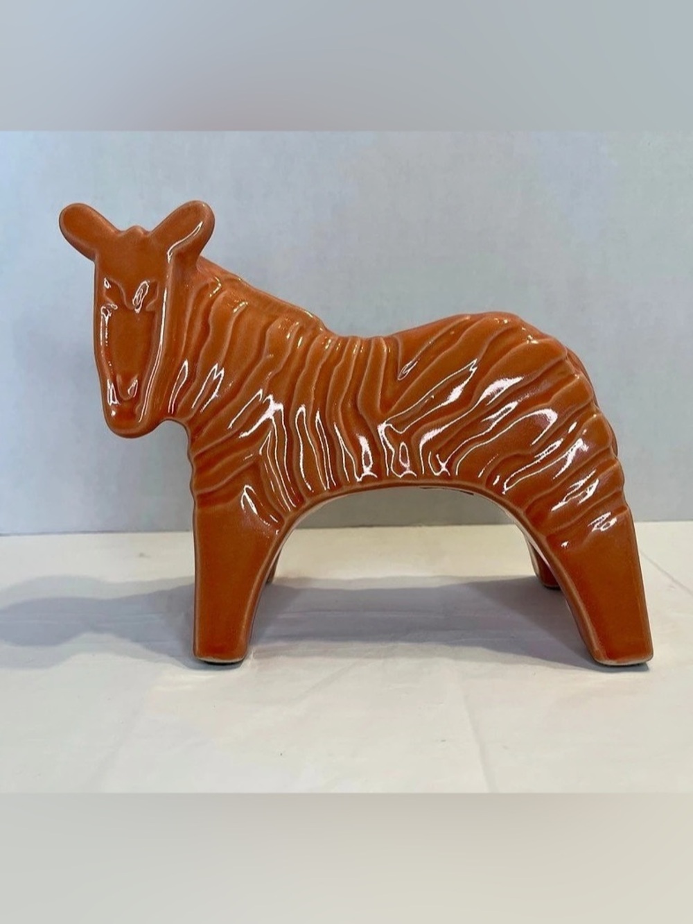 Mid-century modern glazed ceramic zebra figurine in burnt orange